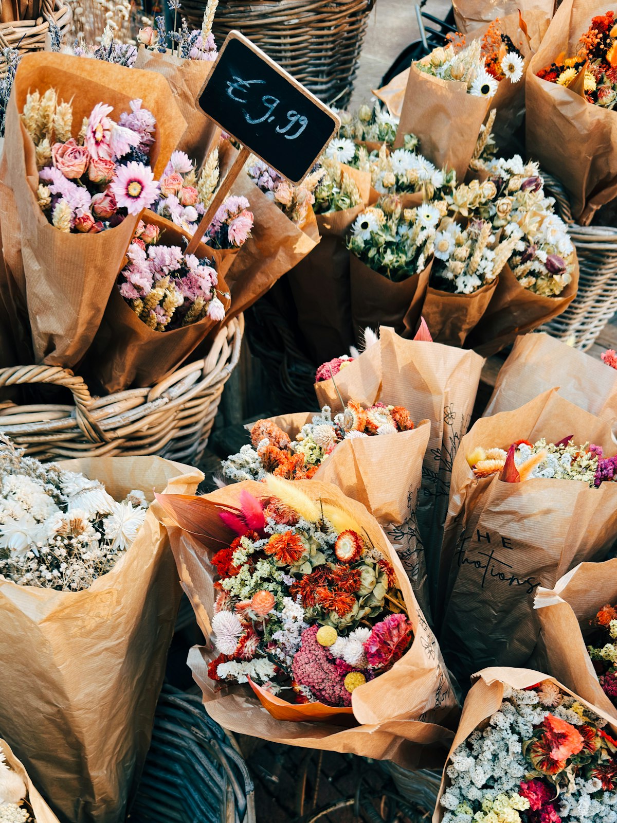 Baskets of fresh flowers at an Amsterdam market stall