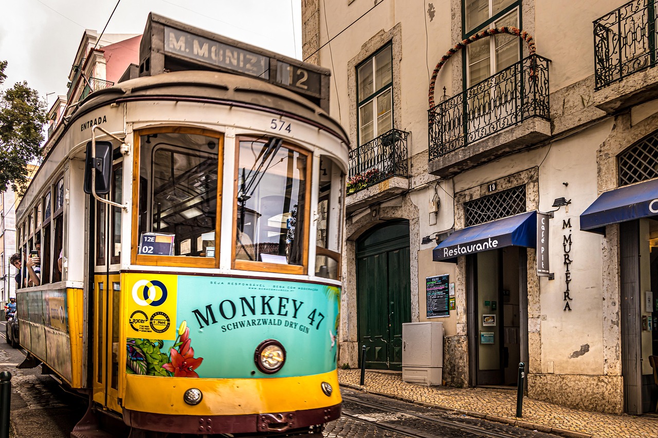 A yellow tram on the historic streets of Lisbon, Portugal
